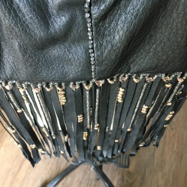 Black leather fringe with silver beads.